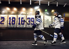 BUFFALO, NEW YORK - DECEMBER 28: Finland's Urho Vaakanainen #23 and Henri Jokiharju #28 walk to the ice surface for preliminary round action against Denmark at the 2018 IIHF World Junior Championship. (Photo by Matt Zambonin/HHOF-IIHF Images)

