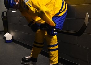 BUFFALO, NEW YORK - DECEMBER 30: Sweden's Jesper Boqvist #21 prepares for a game against Switzerland during the preliminary round of the 2018 IIHF World Junior Championship. (Photo by Andrea Cardin/HHOF-IIHF Images)

